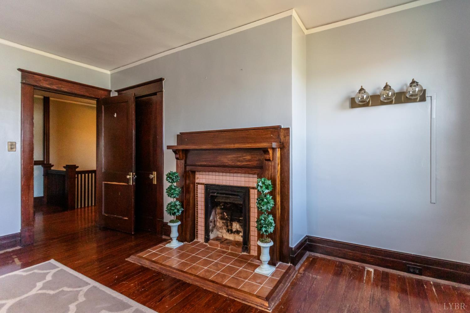 151 Burke Street Appomattox, VA 24522 - Photo 58 of 75 a living room with furniture and a fireplace