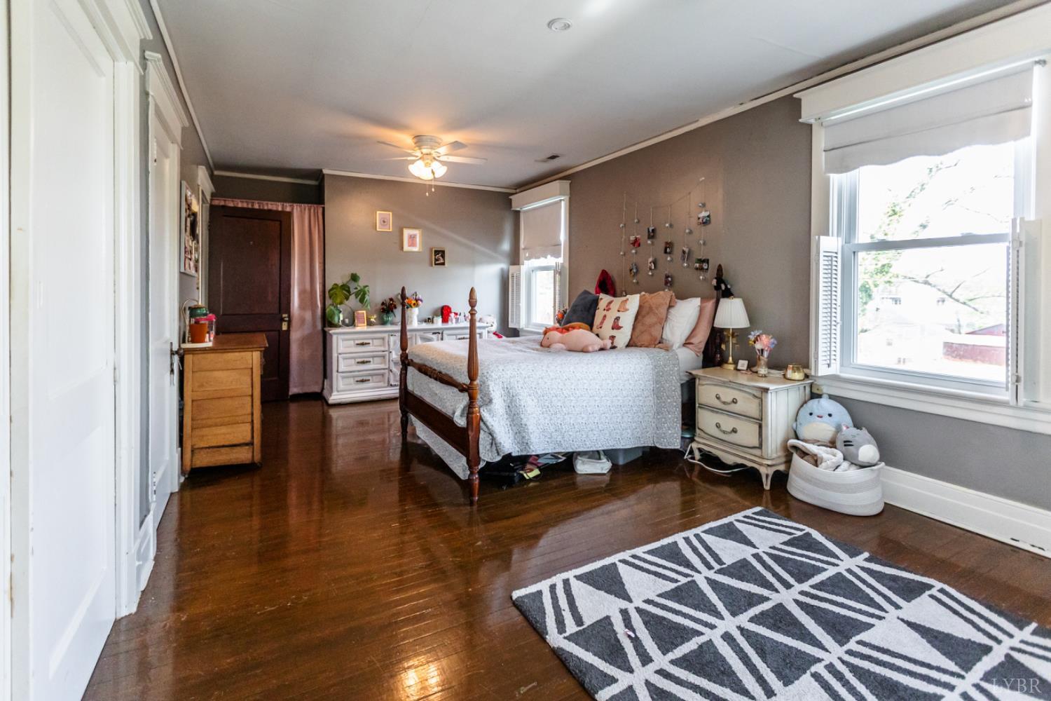 151 Burke Street Appomattox, VA 24522 - Photo 60 of 75 a bed room with furniture and wooden floor