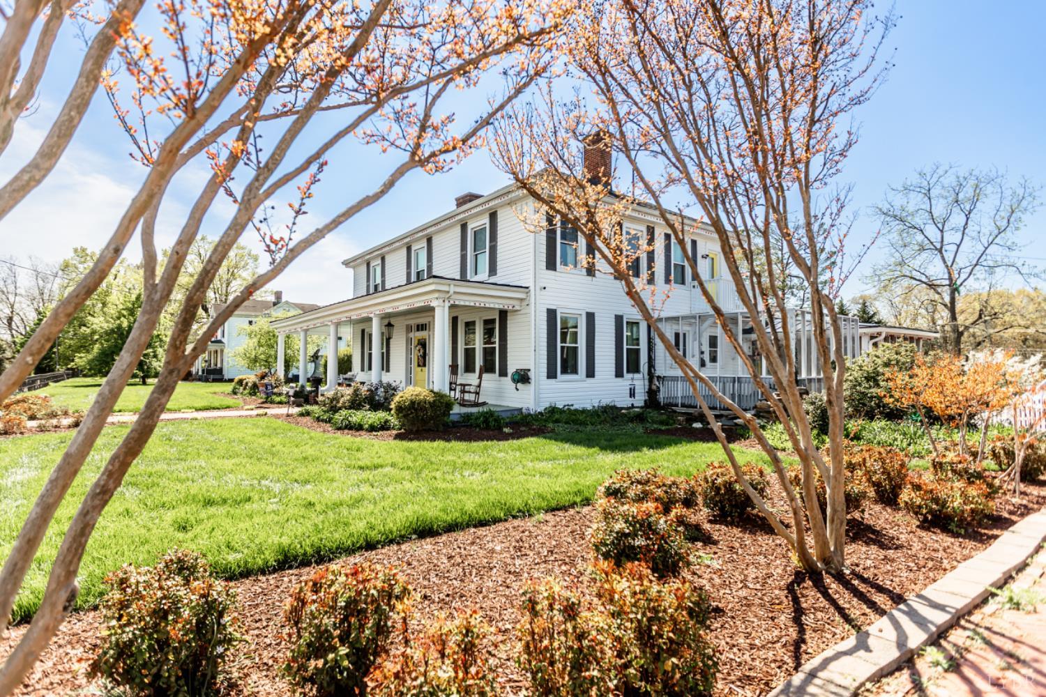 151 Burke Street Appomattox, VA 24522 - Photo 6 of 75 a front view of a house with a yard and porch
