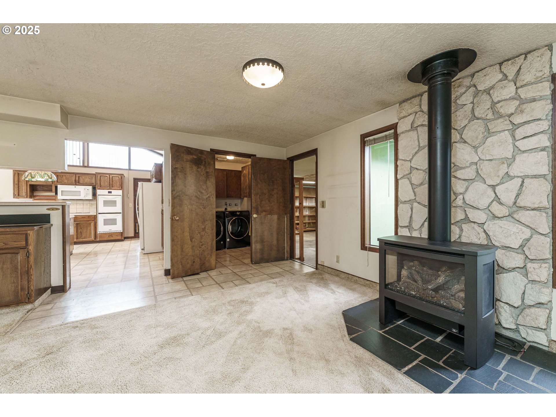 26690 Southeast Kelso Road Boring, OR 97009 - Photo 16 of 48 a living room with furniture and a fireplace