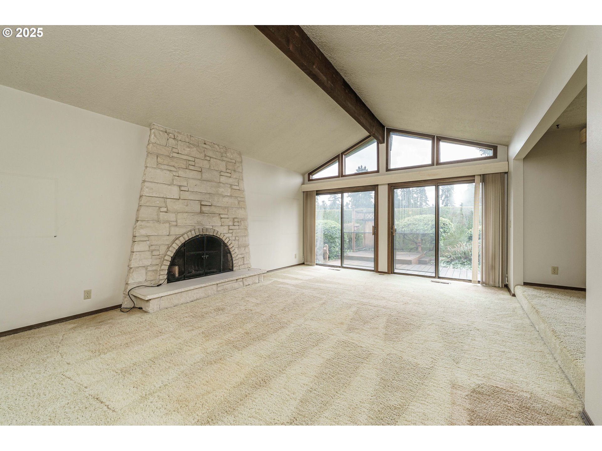 26690 Southeast Kelso Road Boring, OR 97009 - Photo 8 of 48 a view of an empty room with a fireplace and a window