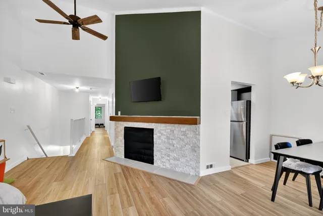 a view of a livingroom with furniture and a flat screen tv