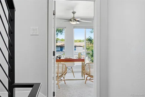 a view of a livingroom with furniture and a window