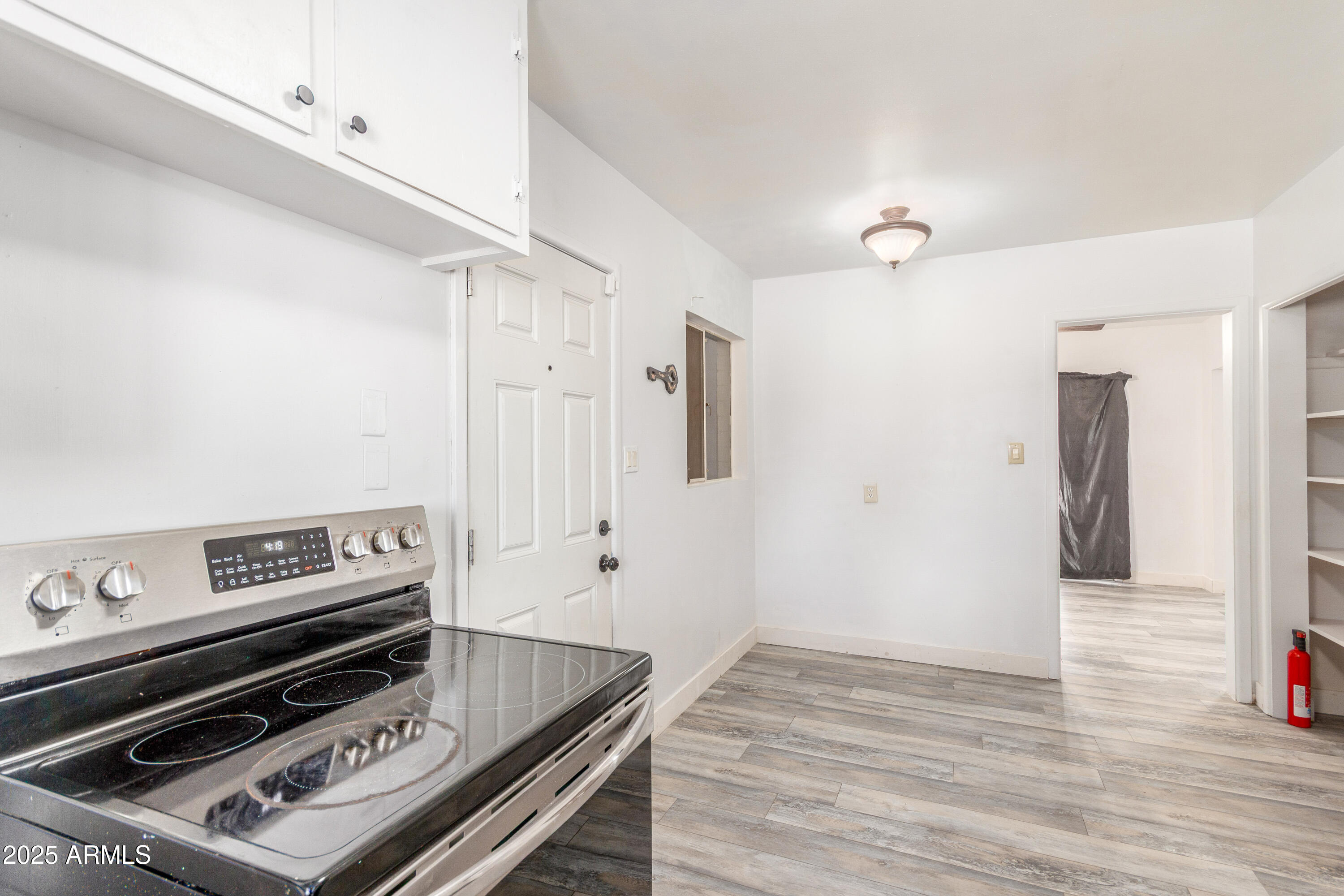 413 East 3rd Street Eloy, AZ 85131 - Photo 14 of 44 a view of kitchen with wooden floor