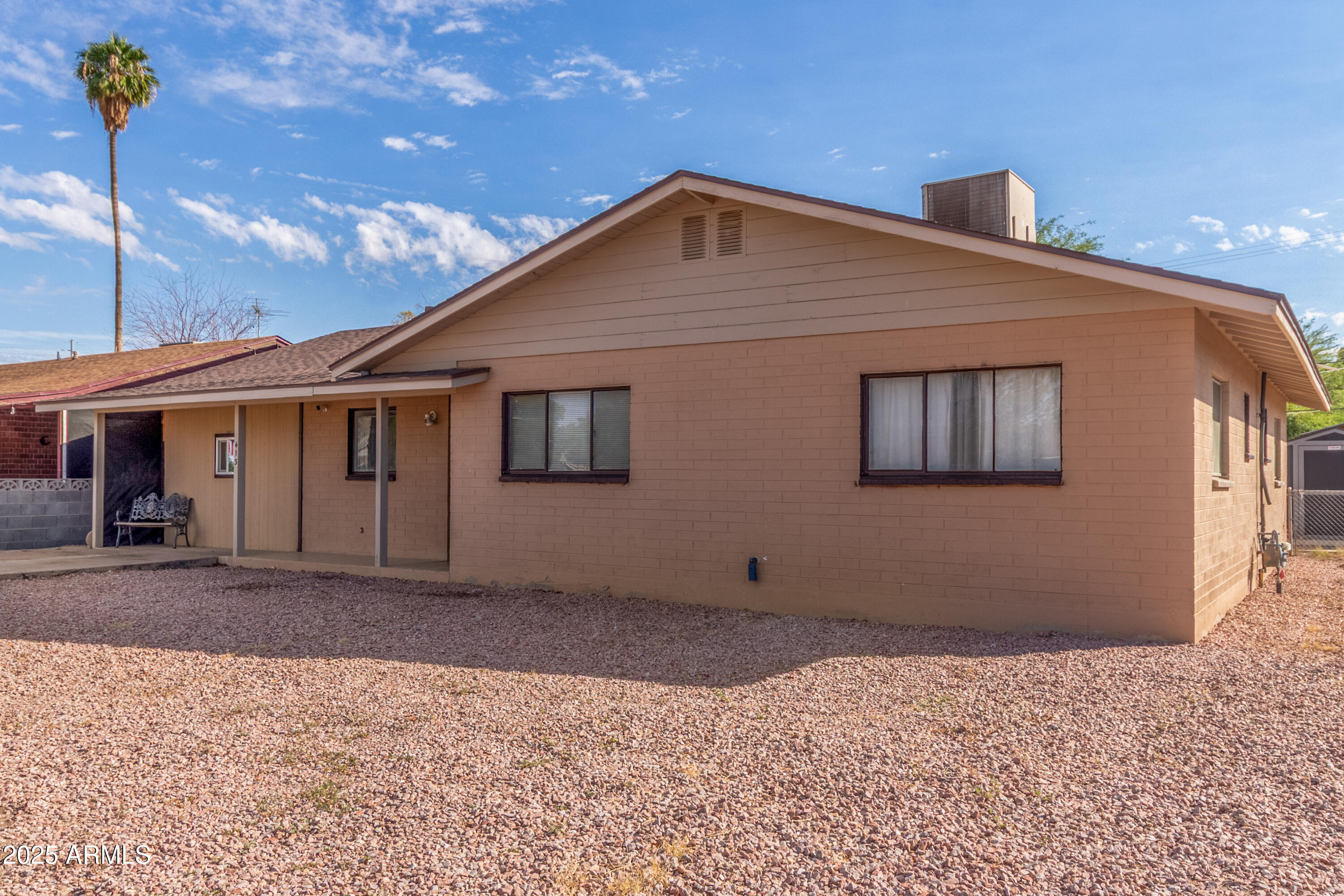413 East 3rd Street Eloy, AZ 85131 - Photo 2 of 44 a front view of a house with a yard