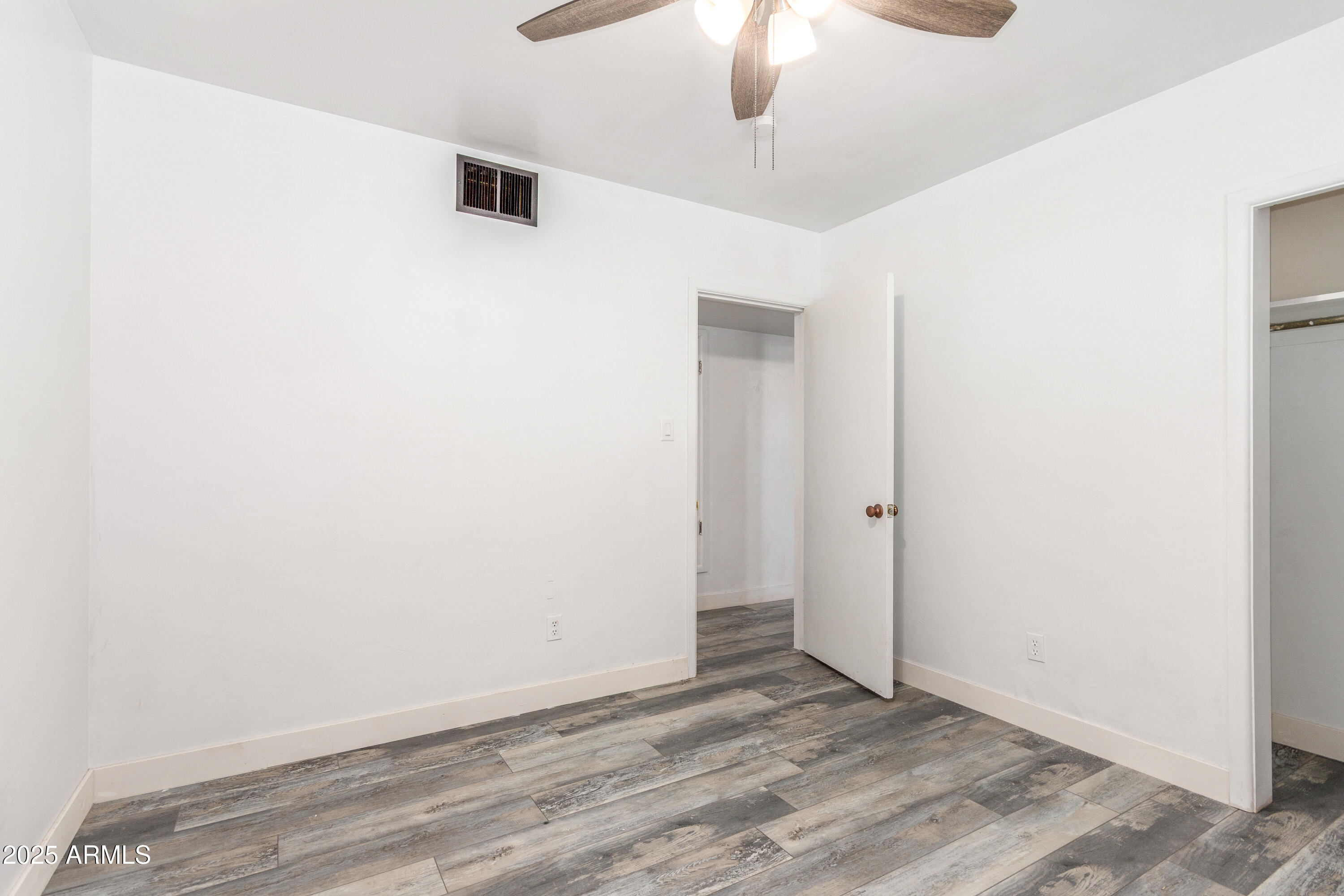 413 East 3rd Street Eloy, AZ 85131 - Photo 26 of 44 an empty room with a empty space and a ceiling fan