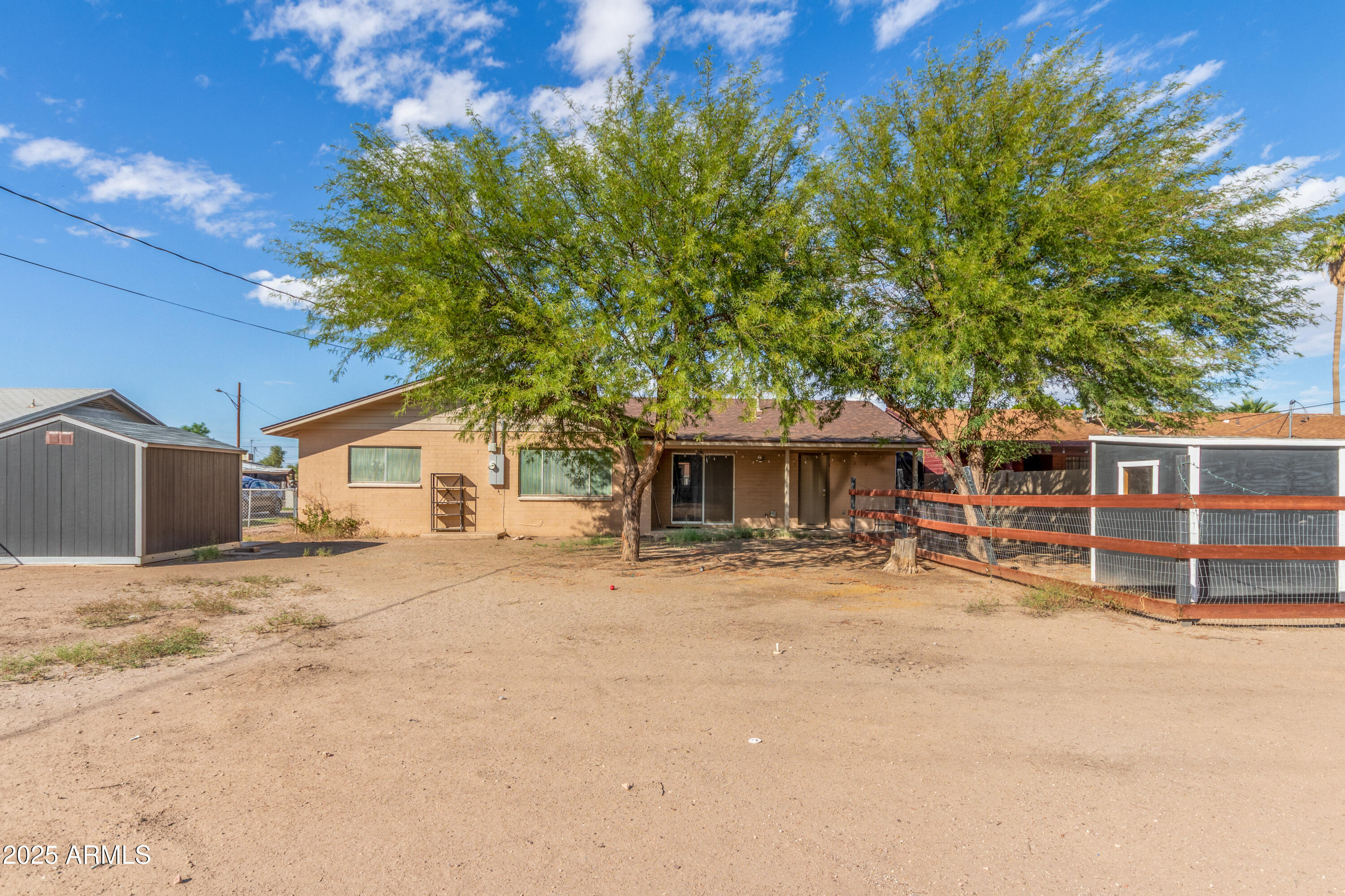413 East 3rd Street Eloy, AZ 85131 - Photo 44 of 44 a white house that has a tree in front of it