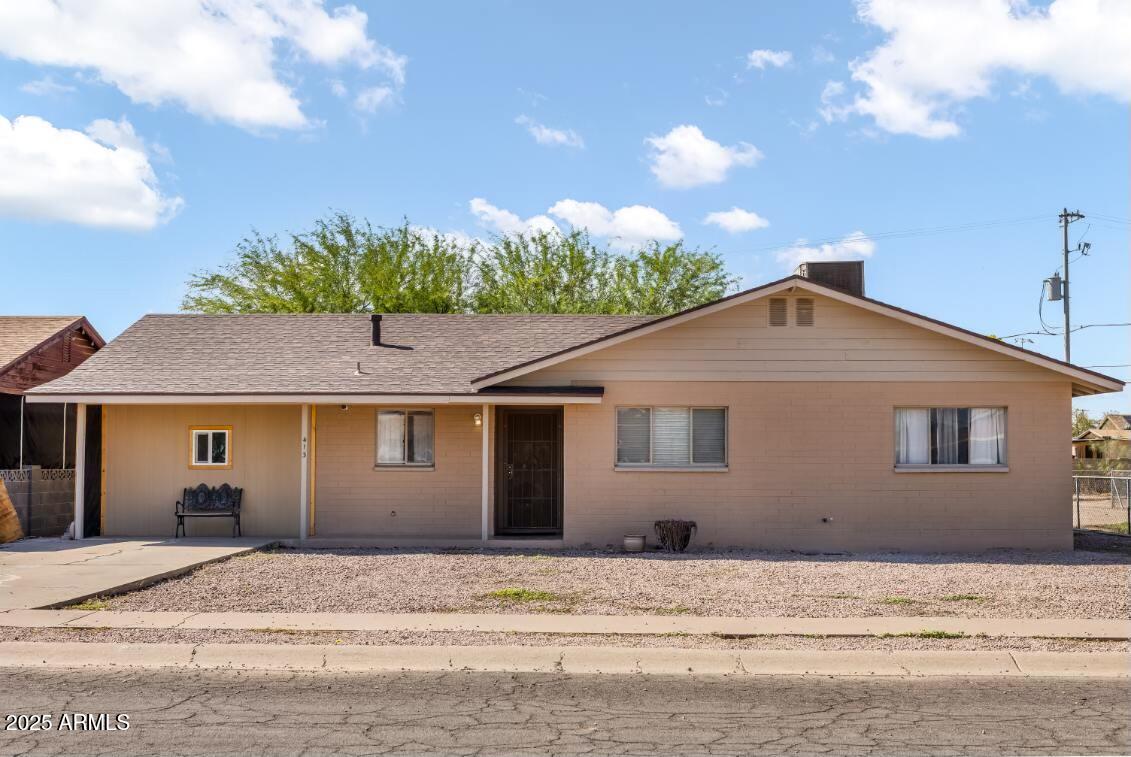 413 East 3rd Street Eloy, AZ 85131 - Photo 5 of 44 a front view of a house with a yard