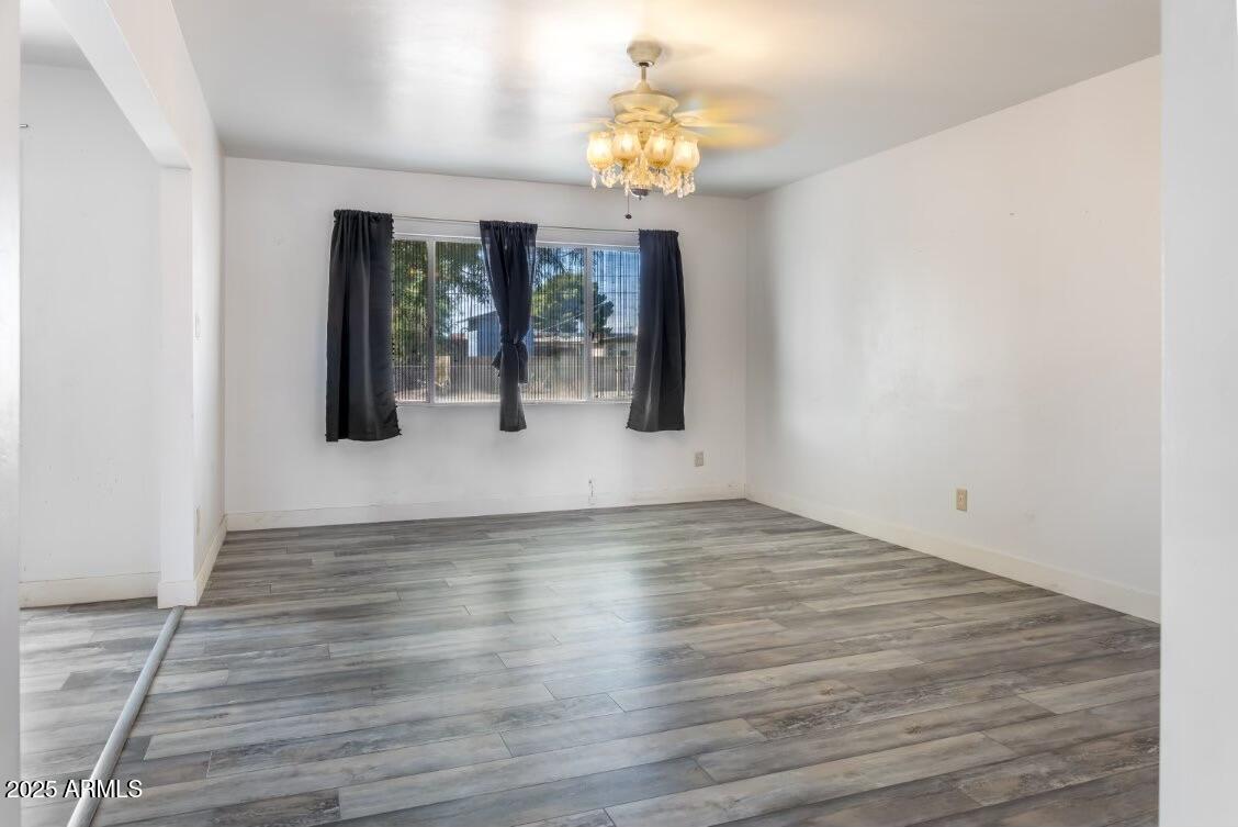 413 East 3rd Street Eloy, AZ 85131 - Photo 6 of 44 a view of an entryway with wooden floor
