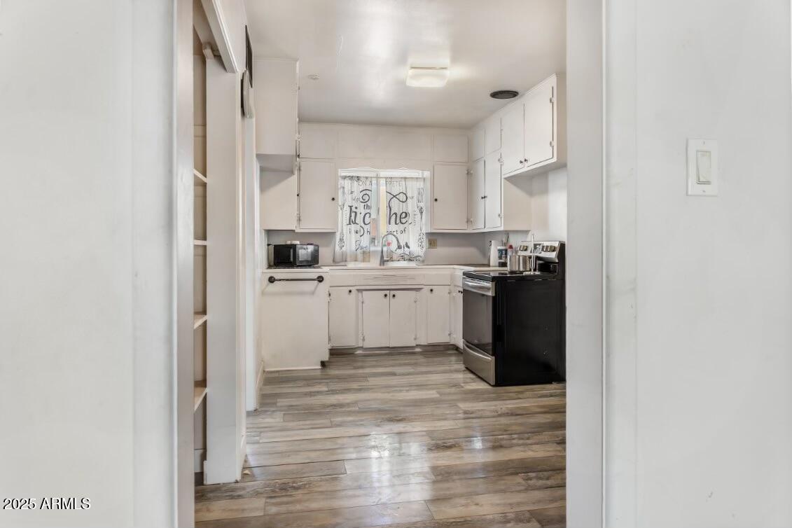 413 East 3rd Street Eloy, AZ 85131 - Photo 10 of 44 a kitchen with stainless steel appliances granite countertop a refrigerator and a sink