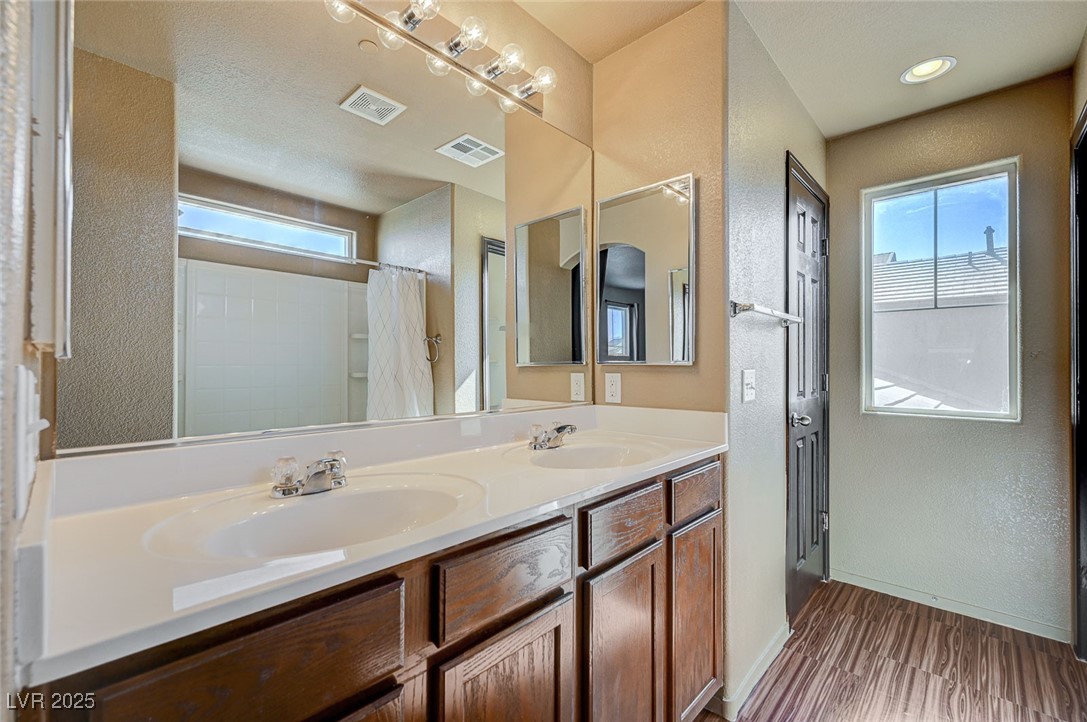 971 Sable Chase Place Henderson, NV 89011 - Photo 23 of 48 Full bathroom featuring, double vanity, and a linen closet and water closet