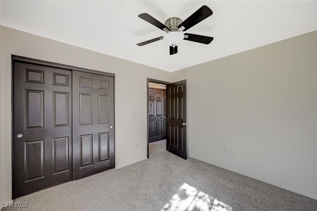 971 Sable Chase Place Henderson, NV 89011 - Photo 35 of 48 U3rd bedroombaseboards, a closet, and light carpet