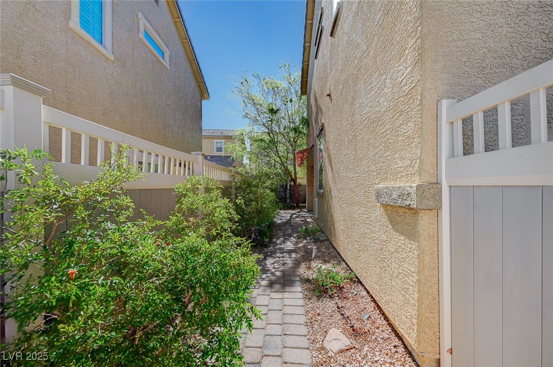 971 Sable Chase Place Henderson, NV 89011 - Photo 41 of 48 pathway leads from front of house to back slider