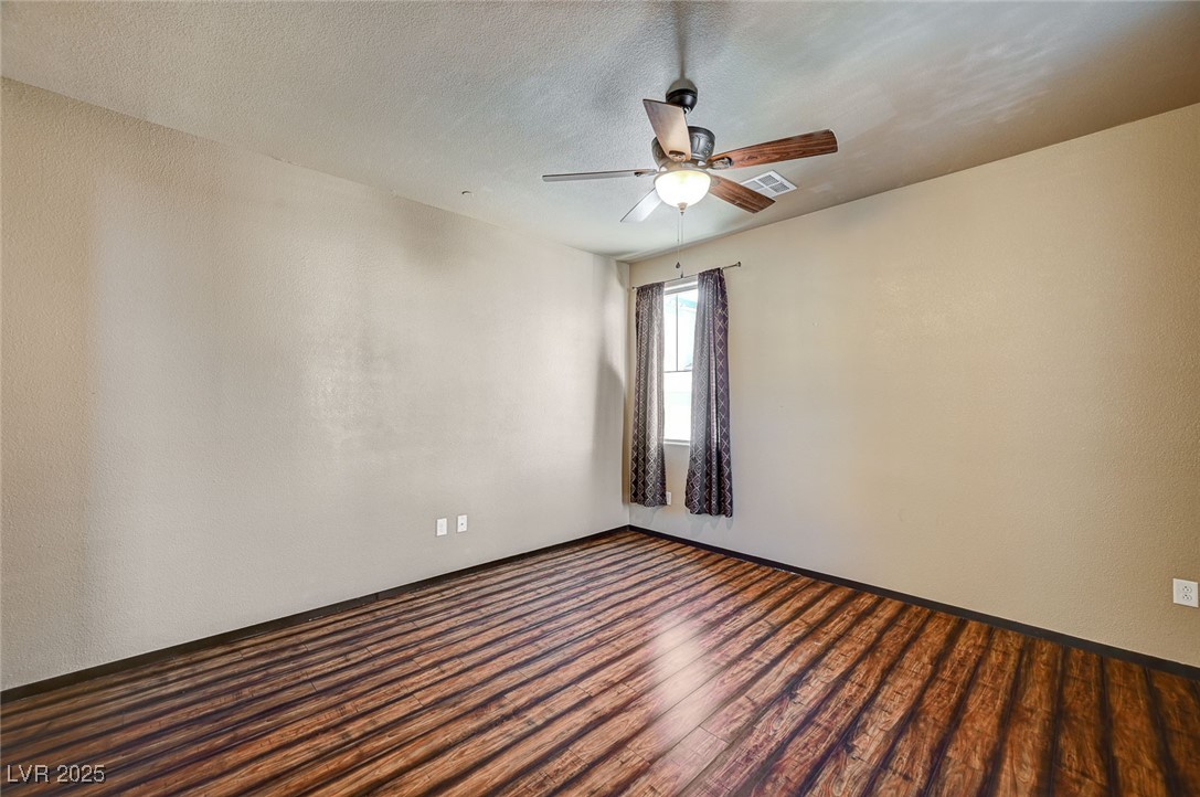 971 Sable Chase Place Henderson, NV 89011 - Photo 5 of 48 Living room featuring, a textured ceiling, ceiling fan, and wood finished floors