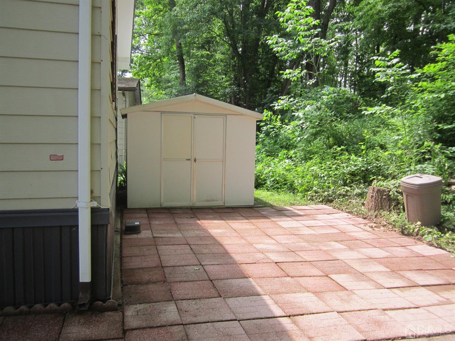 61 Whitman Road North Brunswick, NJ 08902 - Photo 16 of 16 Patio with storage shed.