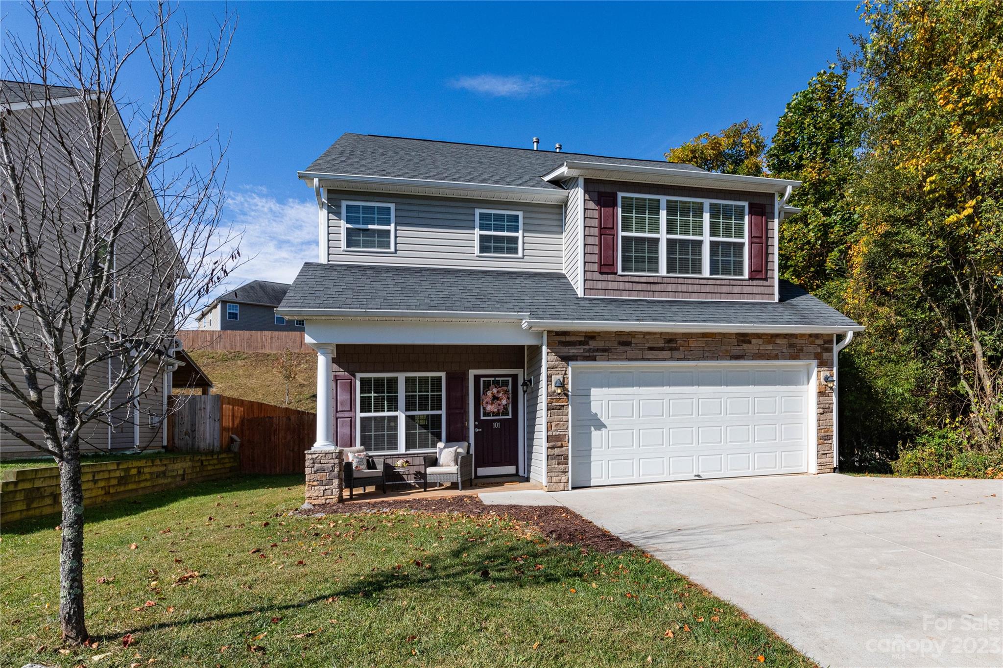 a view of a house with backyard porch and sitting area