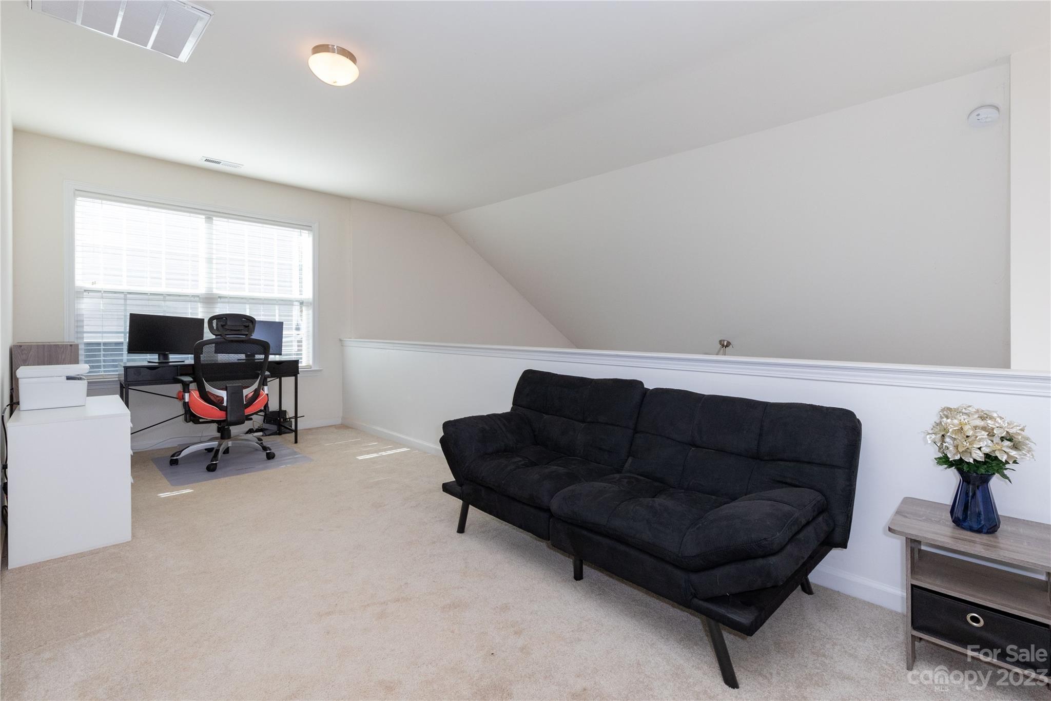 101 Ledbetter Road Arden, NC 28704 - Photo 11 of 21 a living room with furniture and a flat screen tv