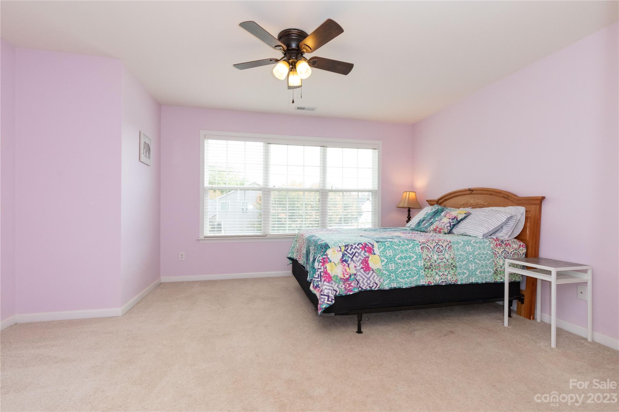 101 Ledbetter Road Arden, NC 28704 - Photo 12 of 21 a bedroom with a bed table and window
