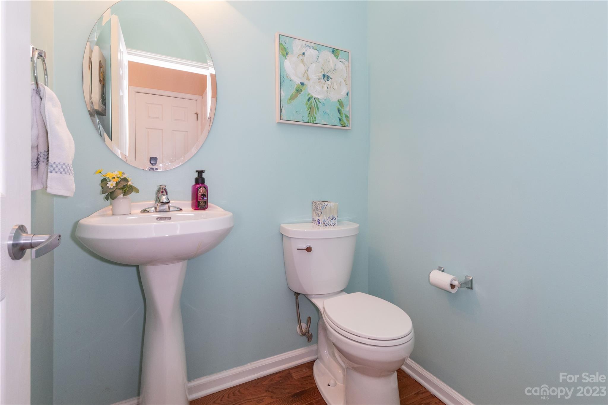 101 Ledbetter Road Arden, NC 28704 - Photo 7 of 21 a bathroom with a sink mirror and toilet
