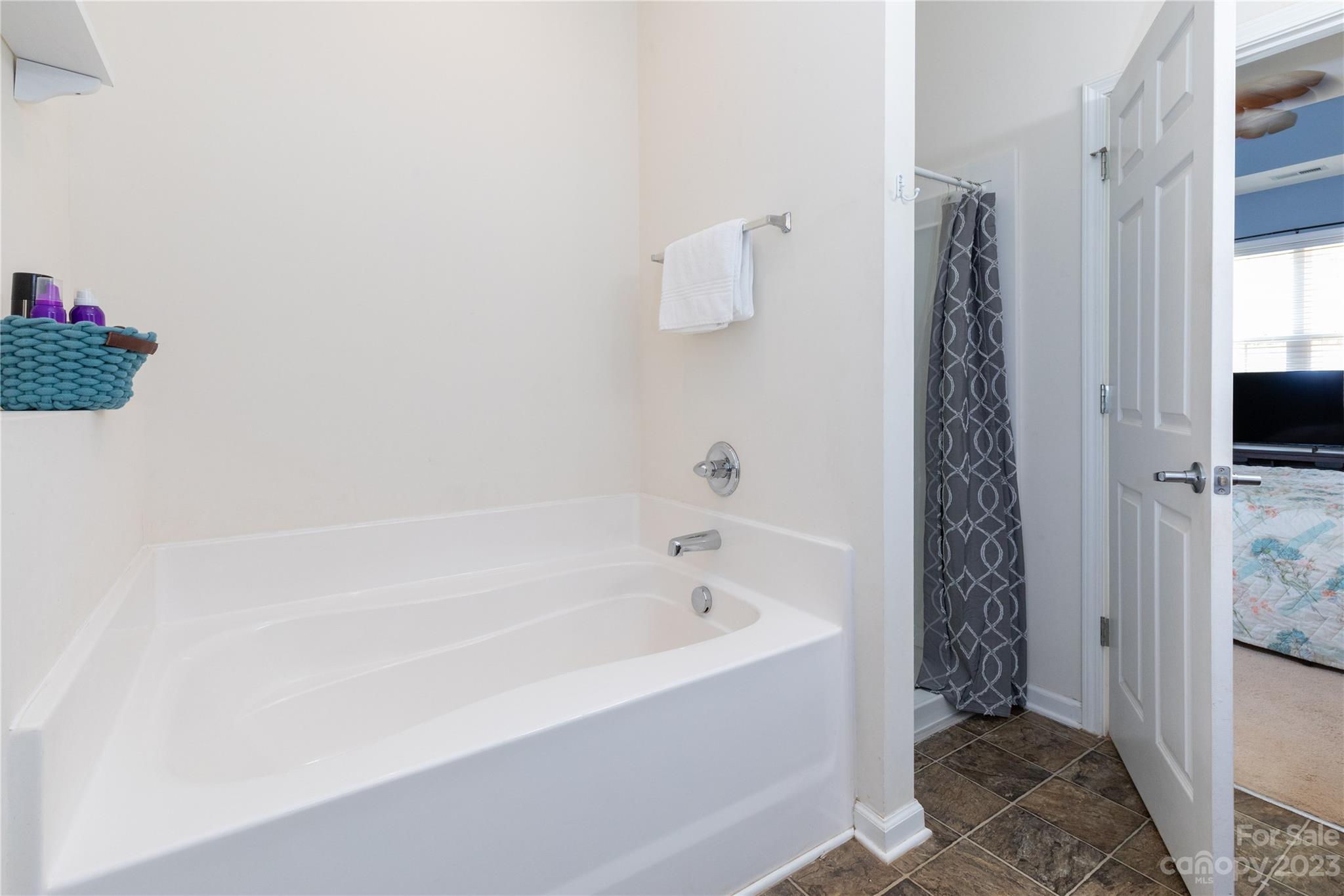 101 Ledbetter Road Arden, NC 28704 - Photo 10 of 21 a bathroom with a bathtub and shower
