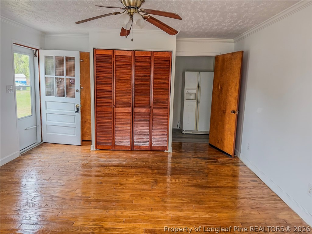 598 Forest Road Lumberton, NC 28358 - Photo 18 of 25 an empty room with wooden floor and windows
