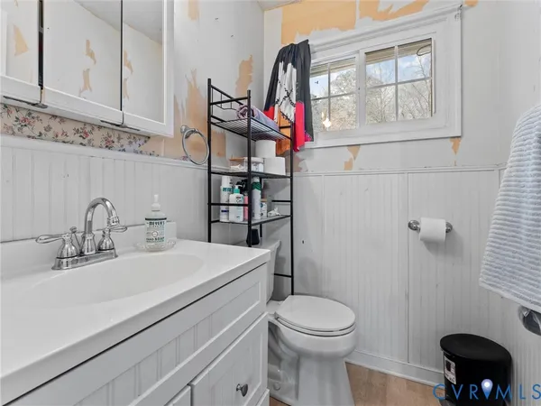 a kitchen with stainless steel appliances a stove a sink and a refrigerator