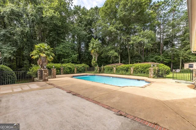 a view of a backyard with trees