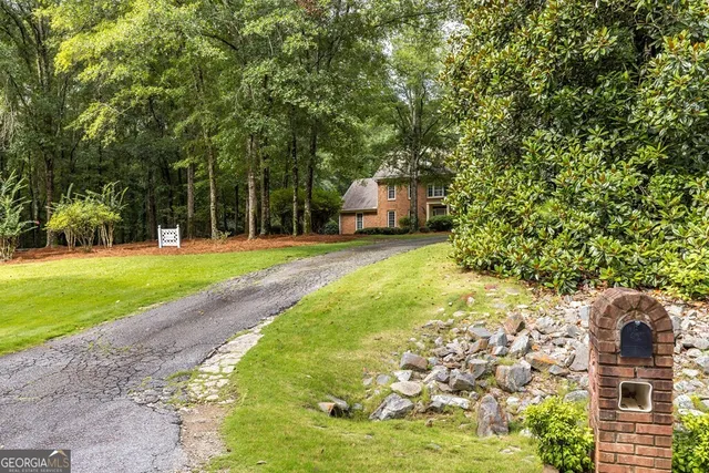 a swimming pool with trees in the background