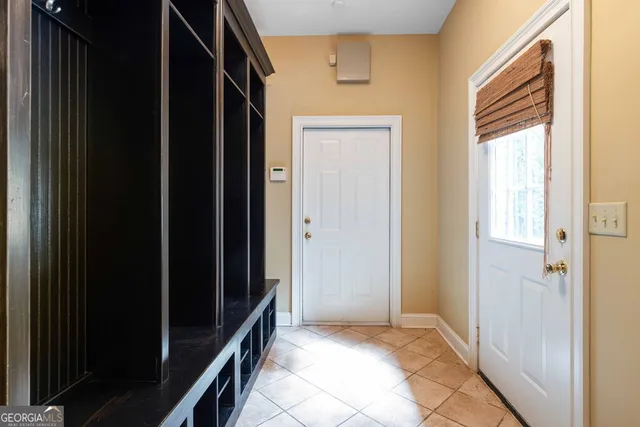 a view of an entryway with wooden floor