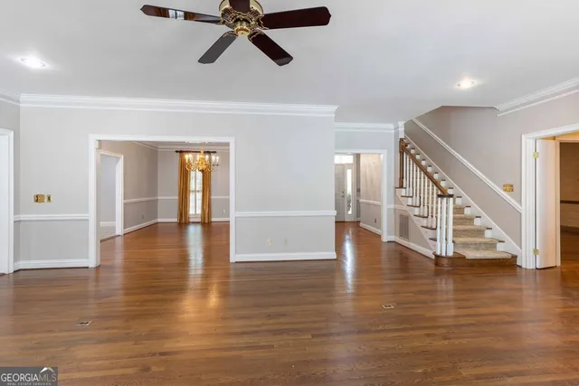 an empty room that has a grey walls