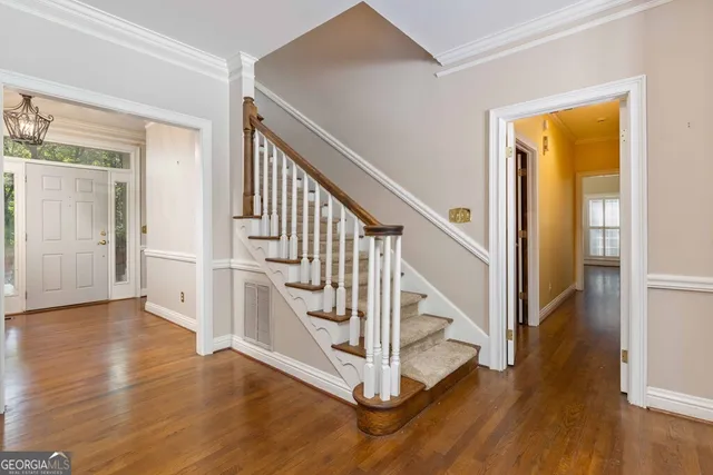 a view of an empty room with a ceiling fan