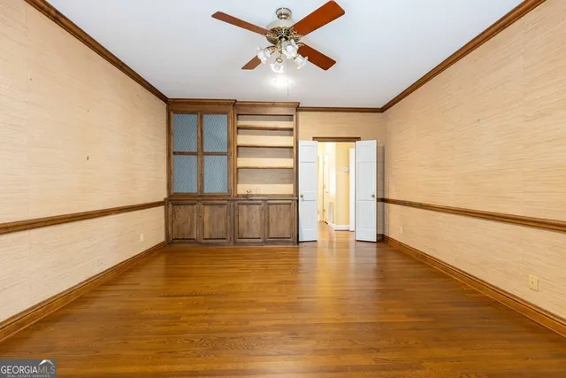 a bathroom with a granite countertop toilet a sink and mirror