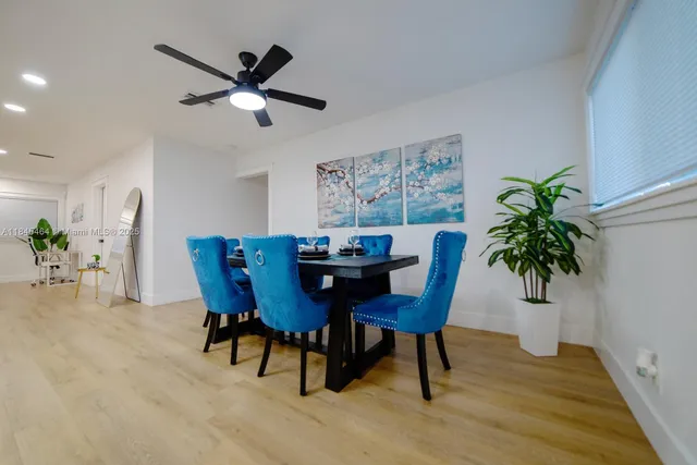 a view of a dining room with furniture and window