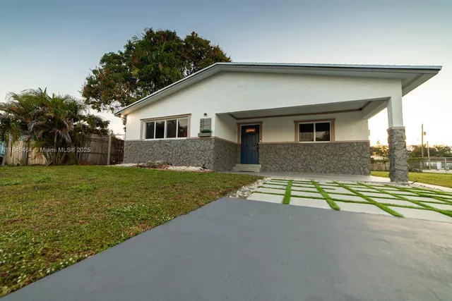 a house view with a garden space