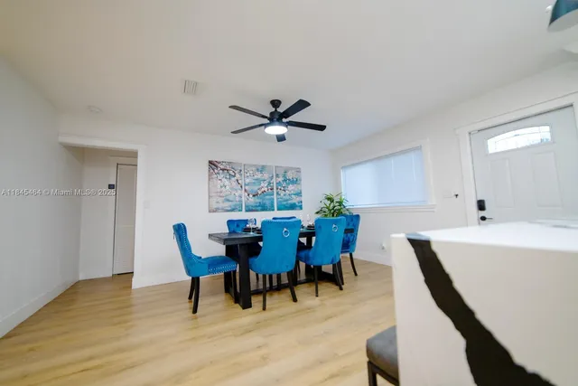 a view of a dining room with furniture and window