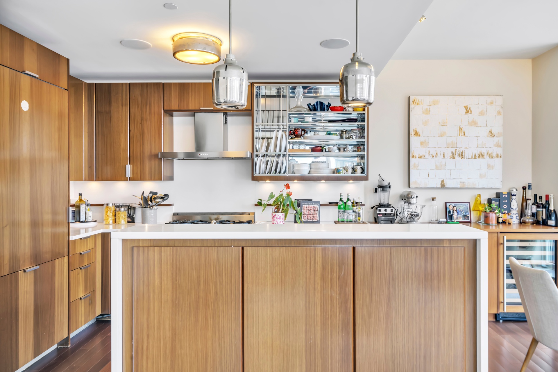 60 Riverside Boulevard, Unit 2402 Manhattan, NY 10069 - Photo 2 of 23 a kitchen with stainless steel appliances a sink and a refrigerator