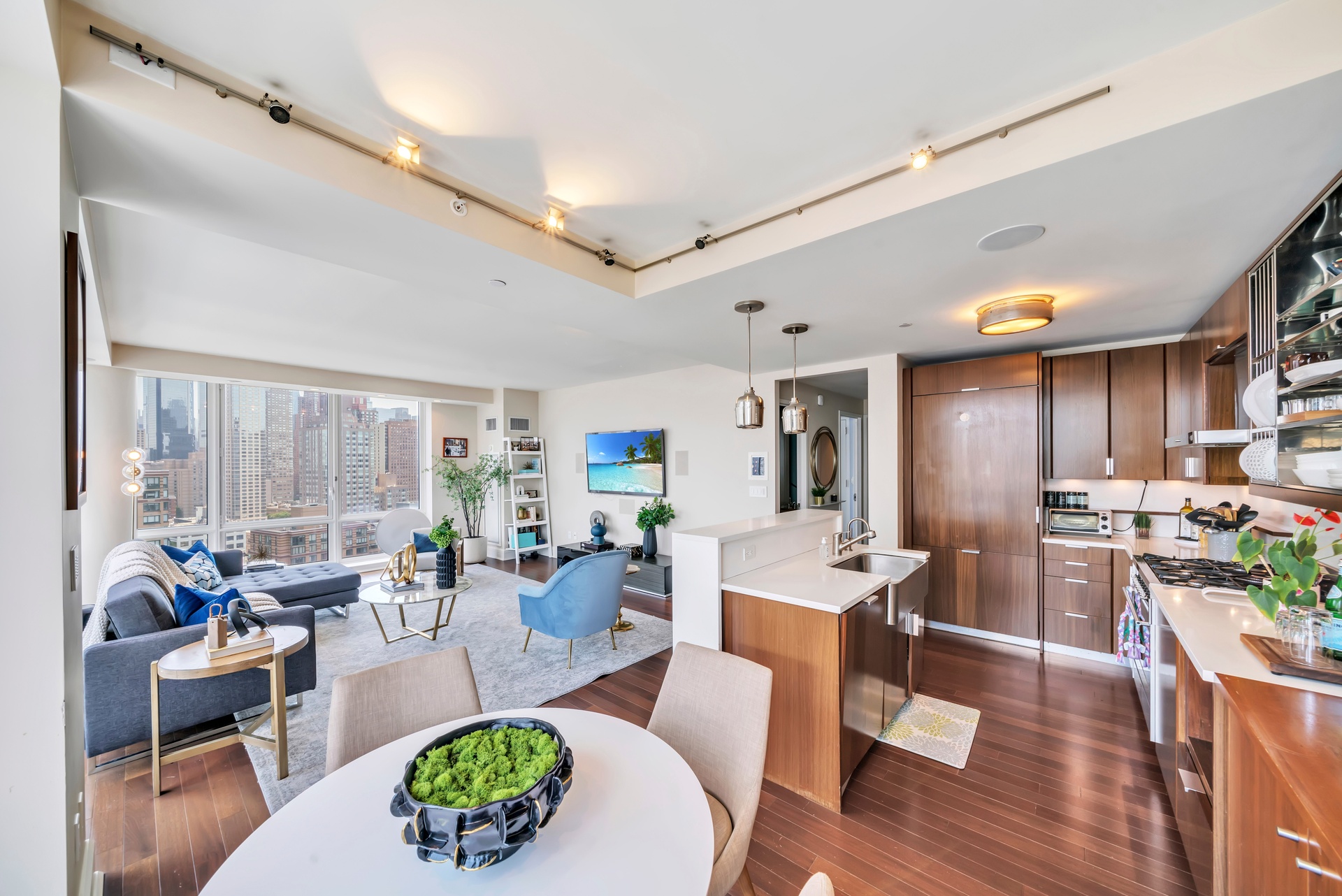 60 Riverside Boulevard, Unit 2402 Manhattan, NY 10069 - Photo 3 of 23 a living room with lots of furniture and a large window