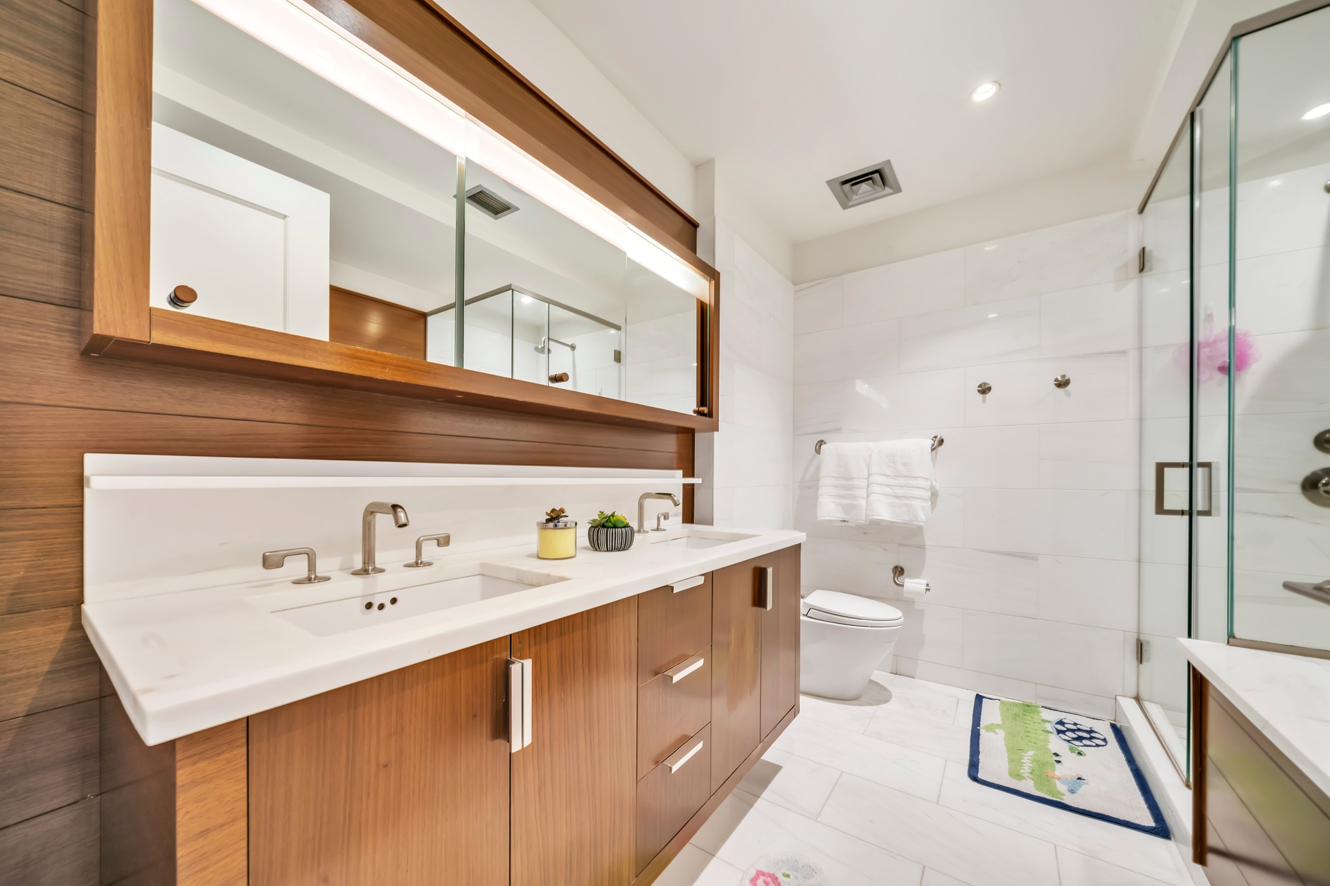 60 Riverside Boulevard, Unit 2402 Manhattan, NY 10069 - Photo 6 of 23 a bathroom with a sink a toilet and shower