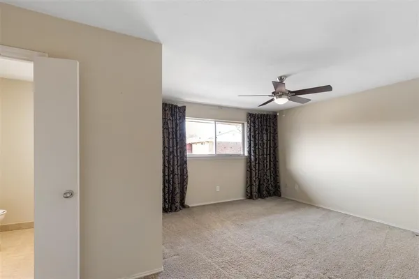 a view of empty room with windows