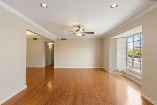 a view of an empty room with glass door