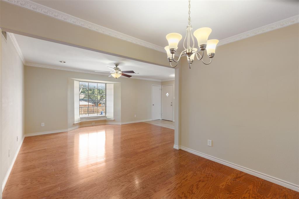 4709 Skillman Street, Unit D Dallas, TX 75206 - Photo 5 of 28 wooden floor in an empty room with a window