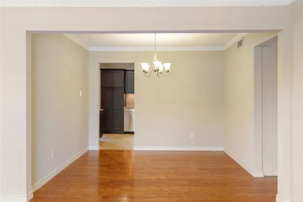 a view of a hallway with an entryway