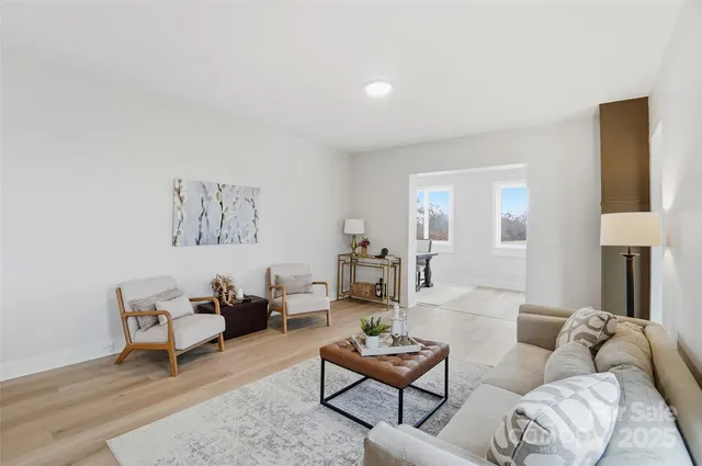 a living room with furniture and a lamp