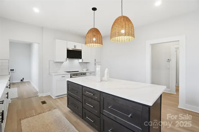 a room with a sink and a mirror