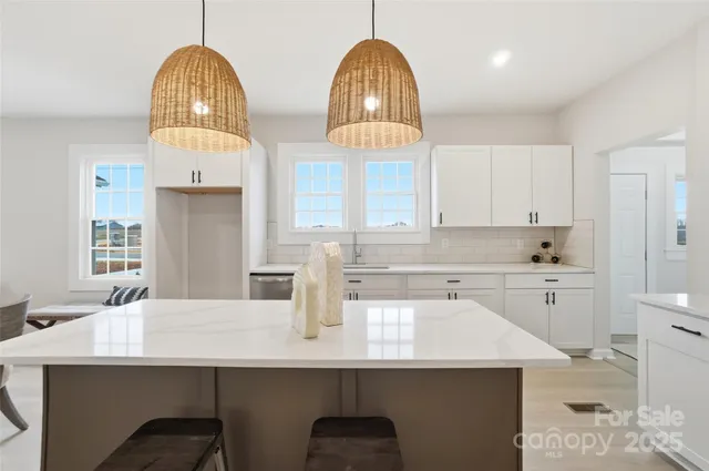 a kitchen with cabinets a sink appliances and a counter