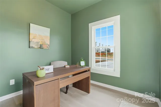 a room with a table and windows