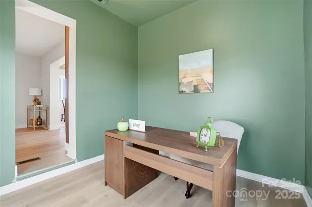 a view of a workspace with furniture