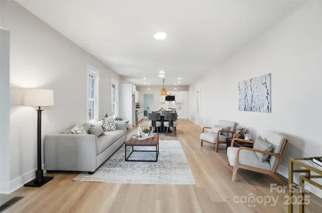 a living room with furniture and a table