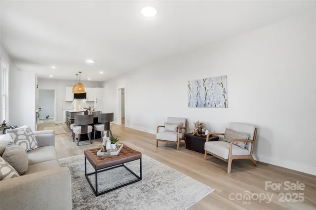 a living room with furniture and a table