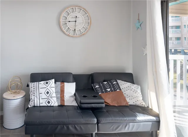 a living room with furniture and a table
